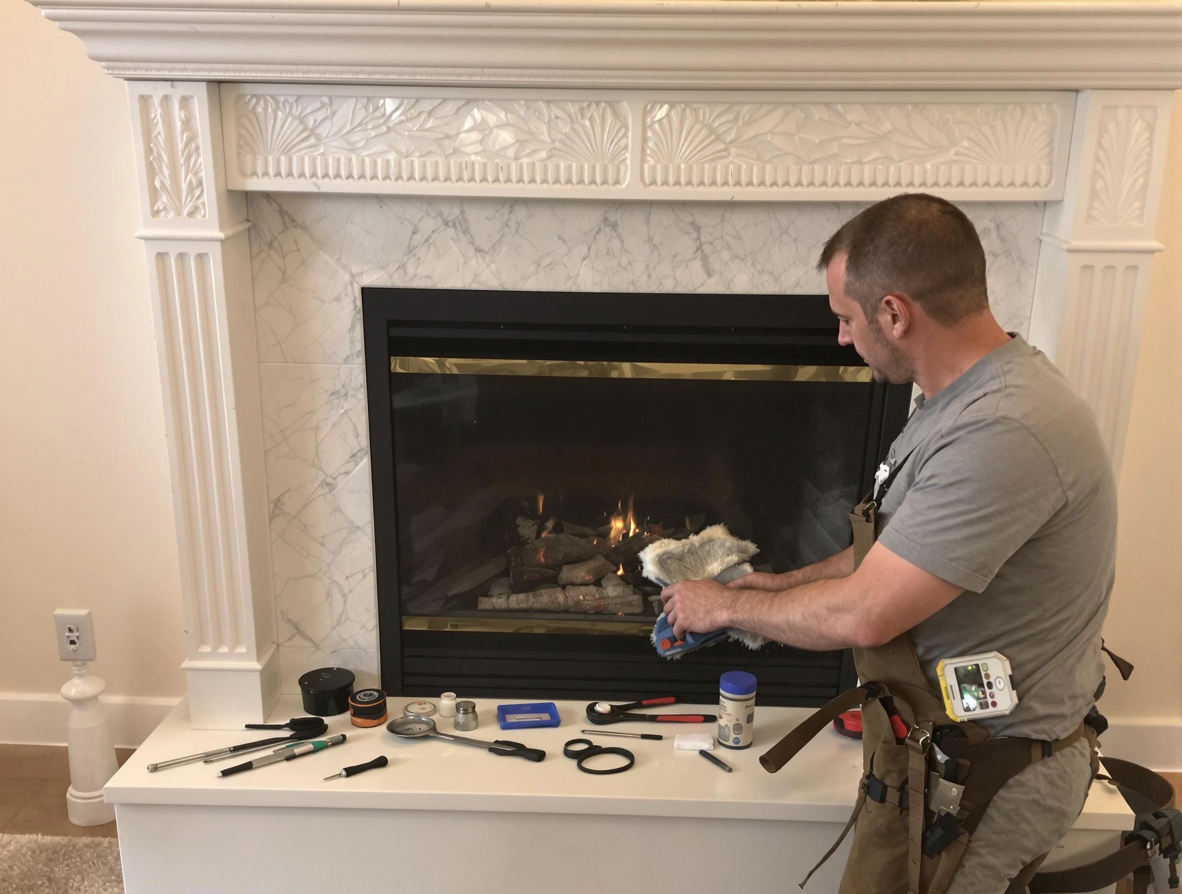 Dedham Chimney Sweep performing fireplace maintenance in Dedham, MA